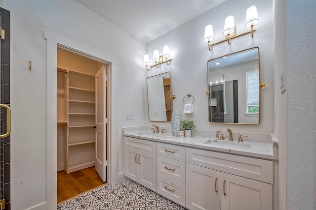 bathroom with vanity, tile patterned floors, and a shower with shower door