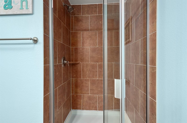 bathroom featuring an enclosed shower