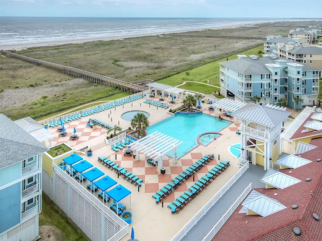 aerial view with a water view and a view of the beach