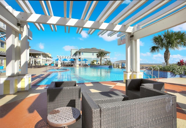 view of swimming pool featuring a patio and a pergola