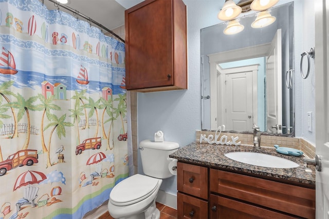 bathroom with toilet, vanity, and a shower with curtain