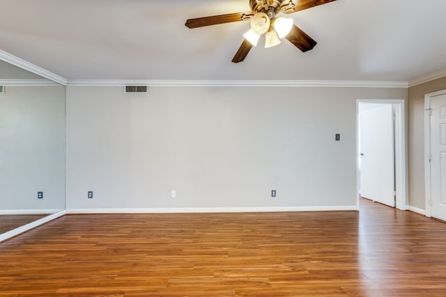 empty room featuring ornamental molding, ceiling fan, and light wood-type flooring