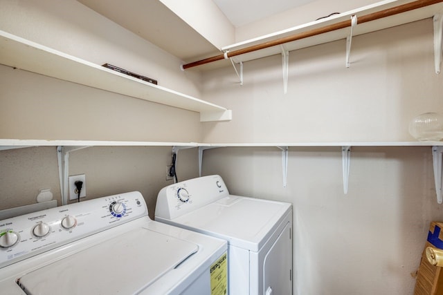 clothes washing area featuring washing machine and dryer