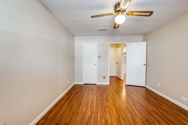 unfurnished room with wood-type flooring and ceiling fan