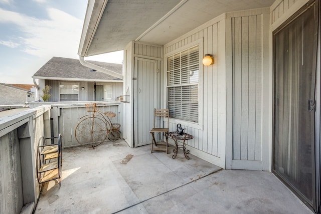 view of patio featuring a balcony