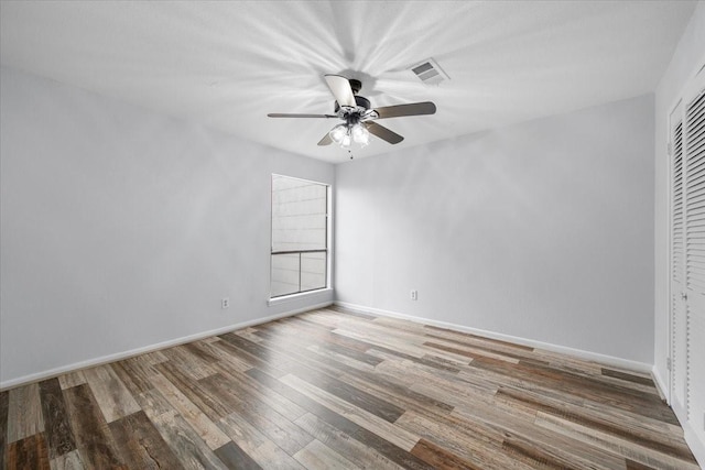 unfurnished room featuring wood-type flooring