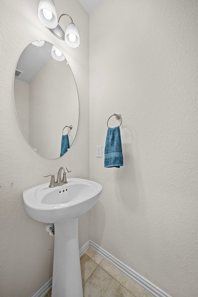 bathroom with tile patterned flooring