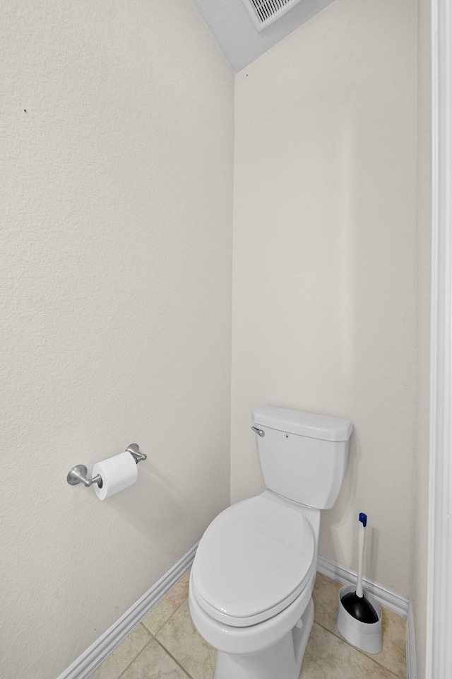 bathroom with tile patterned floors and toilet