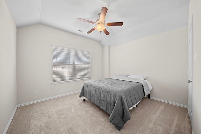 bedroom with lofted ceiling, light carpet, and ceiling fan