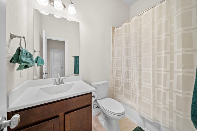 full bathroom with tile patterned floors, shower / tub combo with curtain, vanity, and toilet