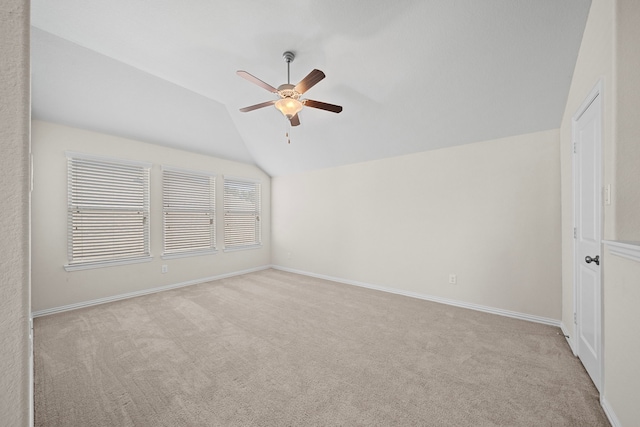 interior space with lofted ceiling and ceiling fan