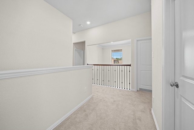 corridor with light colored carpet