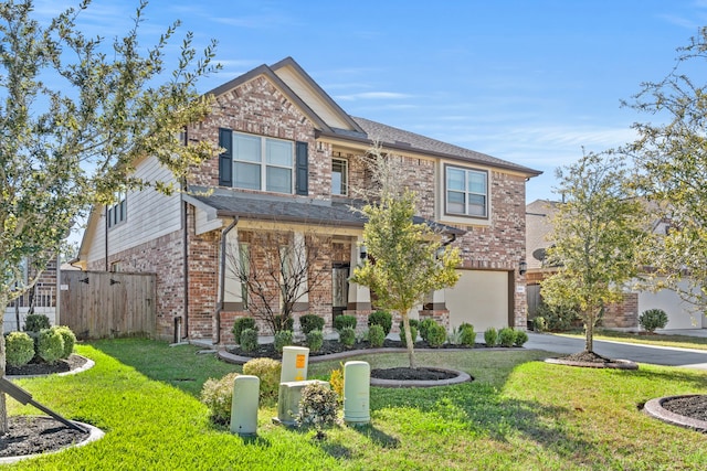 view of front facade with a front lawn and a garage