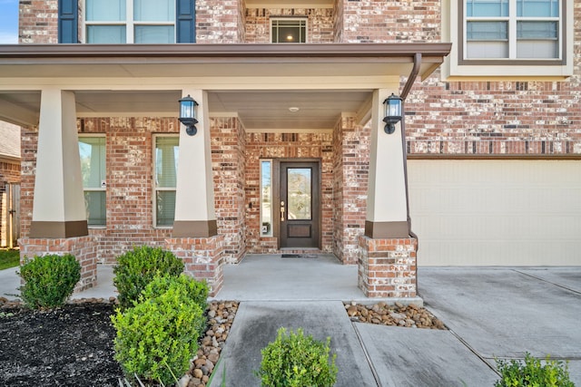 view of exterior entry with a garage