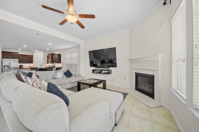 tiled living room featuring ornamental molding and ceiling fan