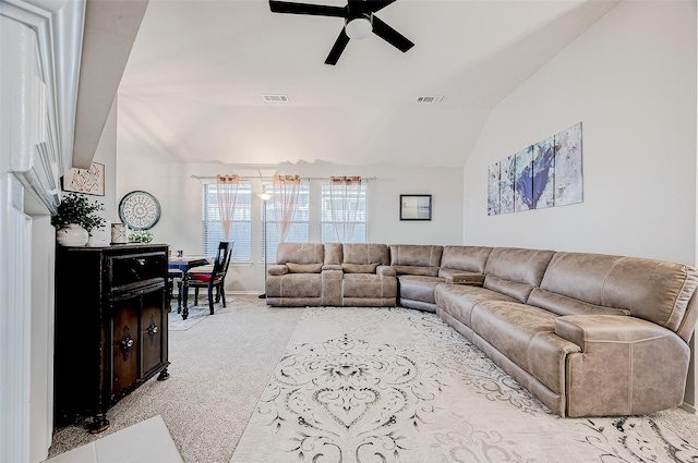 carpeted living room featuring lofted ceiling and ceiling fan