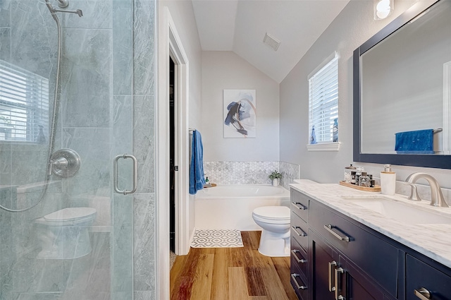 full bathroom featuring toilet, vaulted ceiling, plus walk in shower, wood-type flooring, and vanity