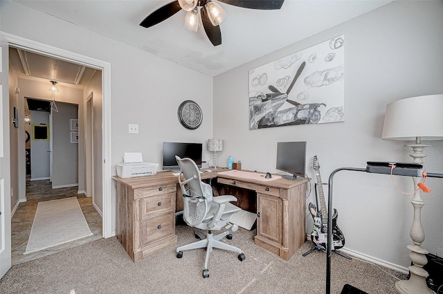 office space with light colored carpet and ceiling fan