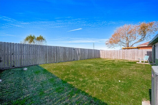 view of yard featuring central AC unit