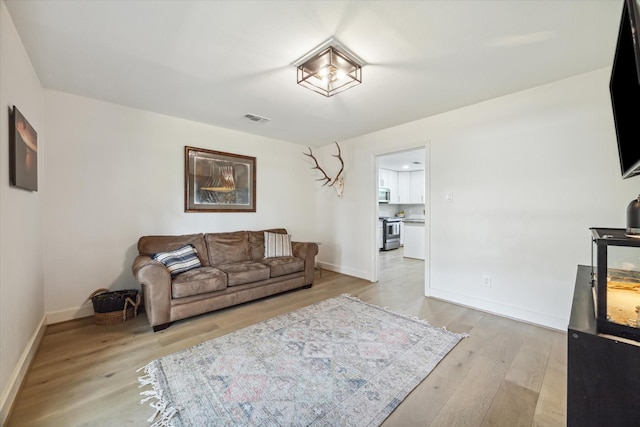 living room with light hardwood / wood-style floors