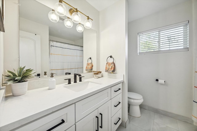 bathroom with tile patterned floors, toilet, and vanity