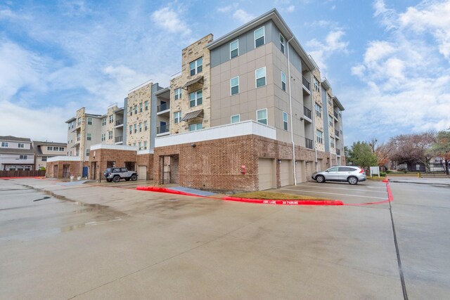 view of property with uncovered parking