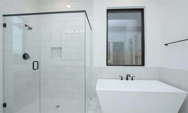 bathroom with independent shower and bath