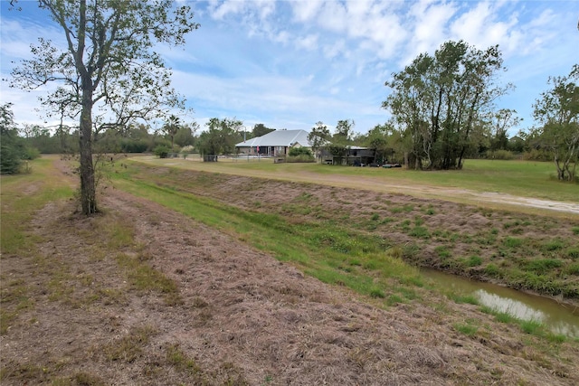 view of yard with a rural view