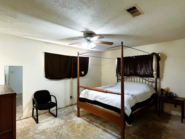 bedroom with a textured ceiling, concrete floors, and ceiling fan