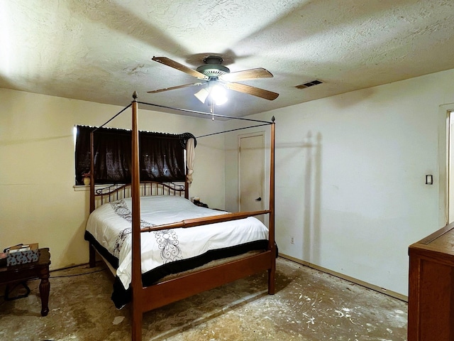 bedroom with concrete flooring, a textured ceiling, and ceiling fan