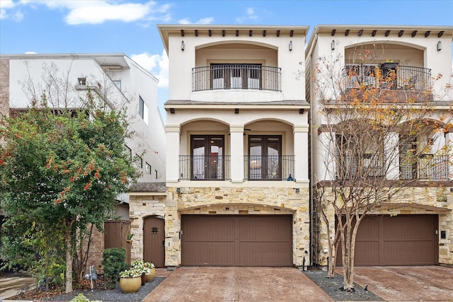 mediterranean / spanish-style house with a balcony and a garage