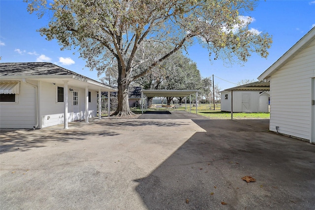 view of yard with a carport