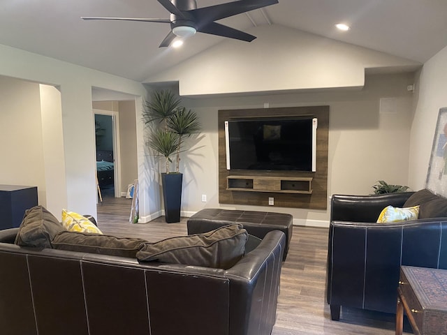 living room featuring vaulted ceiling, ceiling fan, and hardwood / wood-style floors