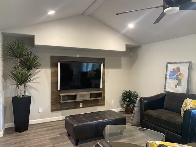 living room with dark wood-type flooring, ceiling fan, and lofted ceiling with beams