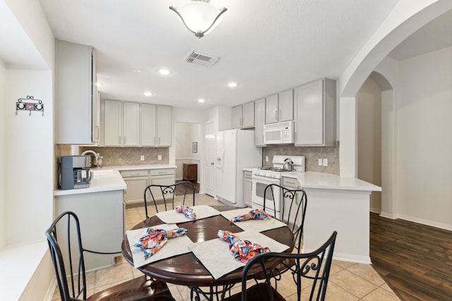 dining room with sink and light tile patterned floors