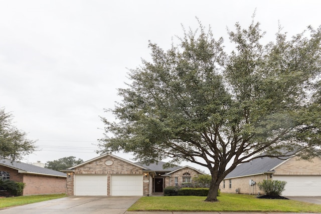 view of front facade with a front lawn and a garage