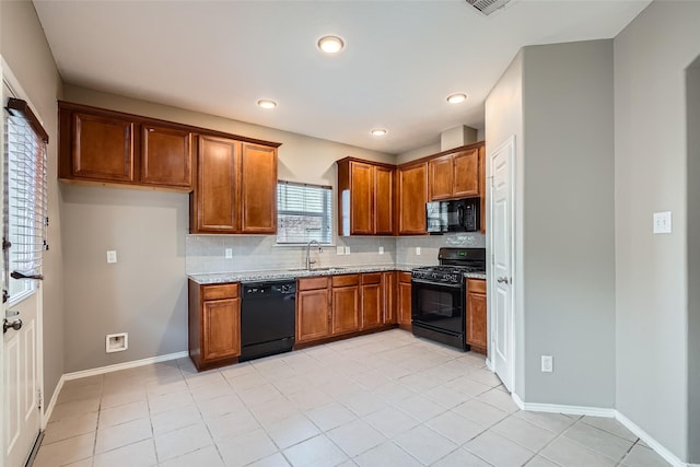 kitchen with sink, light tile patterned floors, decorative backsplash, and black appliances