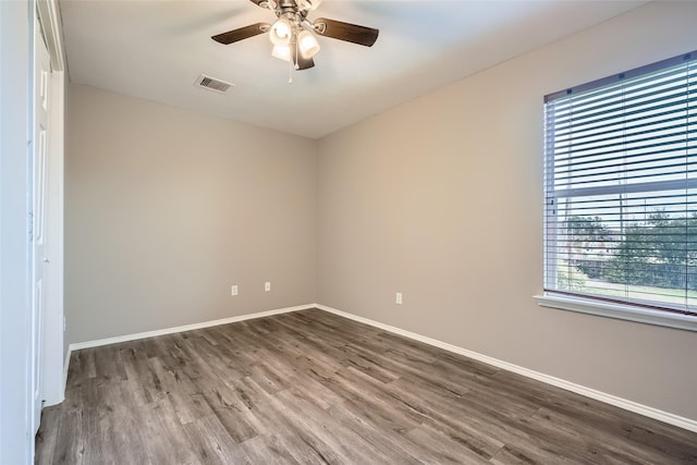 spare room with ceiling fan and hardwood / wood-style flooring