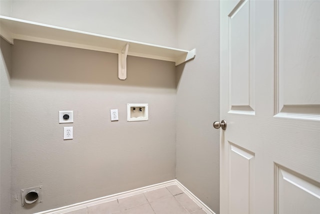 washroom featuring hookup for a washing machine, light tile patterned flooring, hookup for an electric dryer, and gas dryer hookup