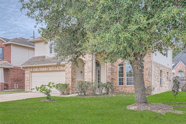 view of front facade featuring a front yard and a garage