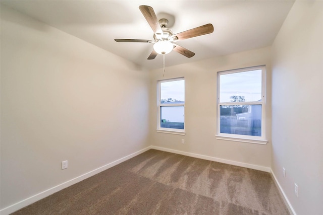 spare room with ceiling fan and carpet flooring