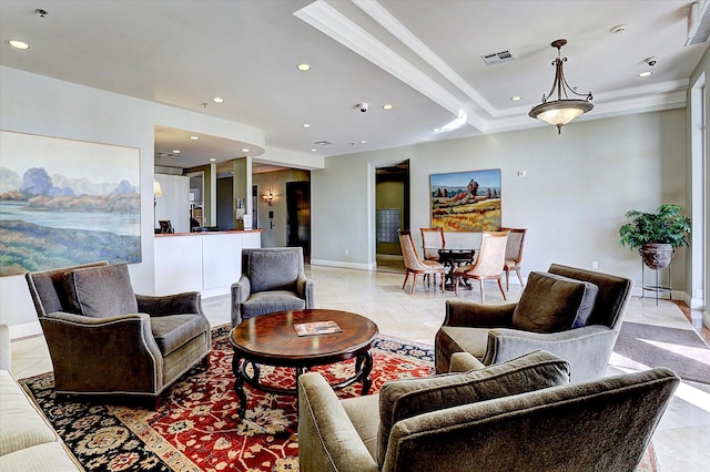 living room featuring ornamental molding and a tray ceiling