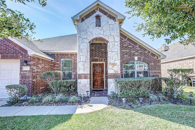 property entrance with a lawn and a garage