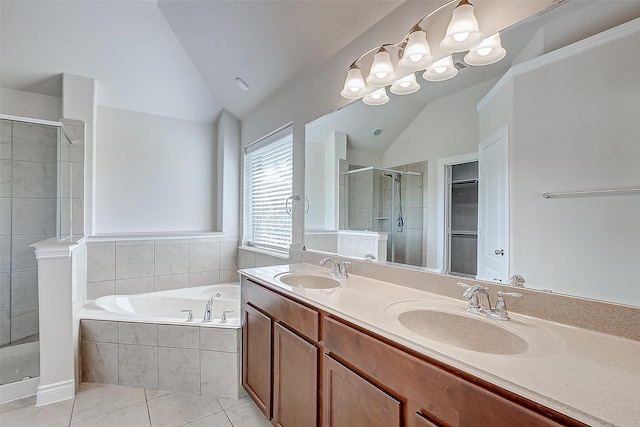 bathroom featuring independent shower and bath, tile patterned flooring, vaulted ceiling, and vanity