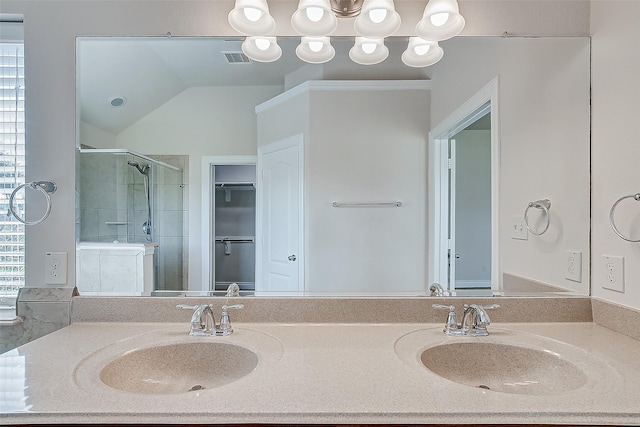 bathroom featuring lofted ceiling, walk in shower, and vanity