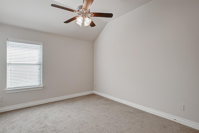 carpeted empty room with ceiling fan and lofted ceiling