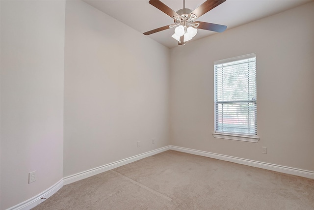 unfurnished room featuring light colored carpet and ceiling fan