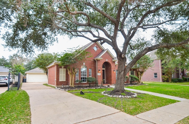 view of front facade with a front yard and a garage