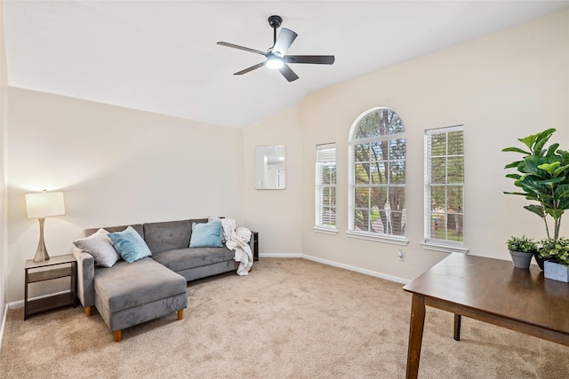 carpeted living room with lofted ceiling and ceiling fan