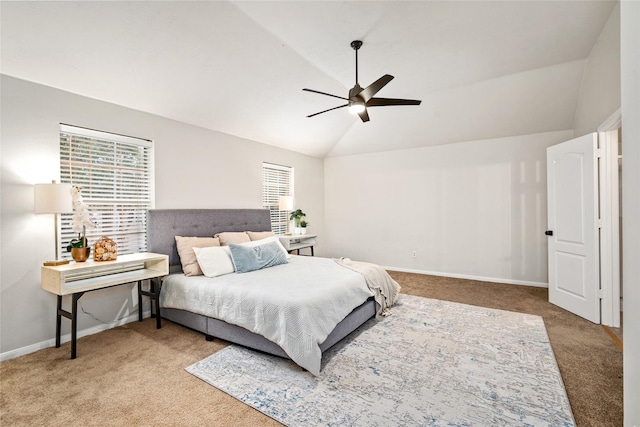 carpeted bedroom featuring lofted ceiling and ceiling fan